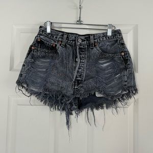 Vintage Levi’s, High-waisted, Distressed Jean shorts.